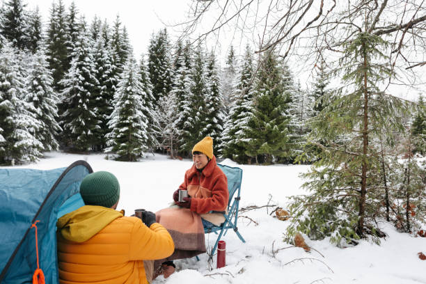 istock Couple on a winter camping 2169986580