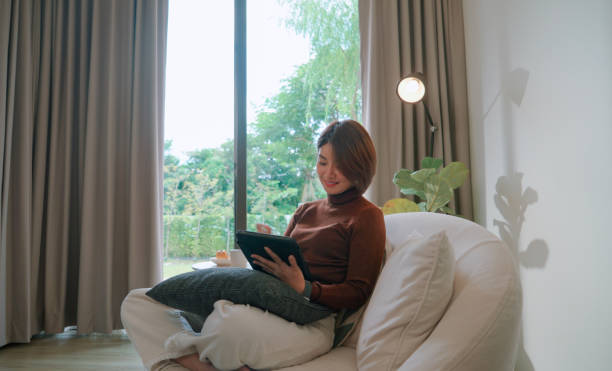 istock Asian woman working on tablet 2169994809