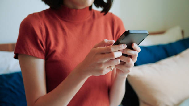 istock Asian woman using ai apps on bed 2169995601
