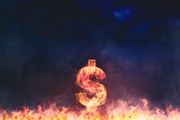 istock Hyperinflation concept. Image of dollar symbol burning with black background in the hell 2169995848