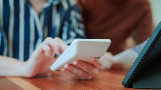 istock Asian couple calculating expenses at home 2169996330