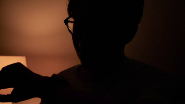 Asian man using ai apps at home
