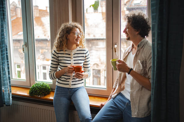 istock Enjoying a cozy afternoon conversation with coffee by the window in a charming Budapest apartment 2169997561