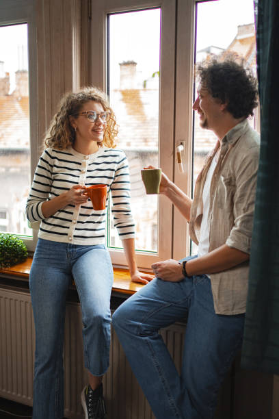 istock Cozy conversation between friends over warm drinks in a charming Budapest apartment at dawn 2169998559
