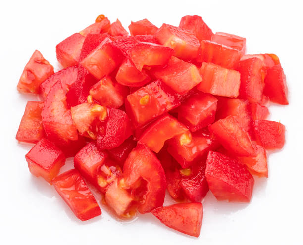 istock Peeled and diced tomatoes isolated on white background. Macro shot. 2169998660