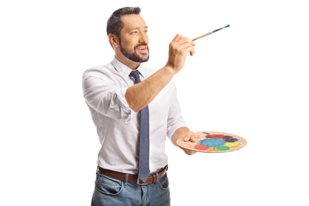 istock Man holding a color palette and a brush 2170007294