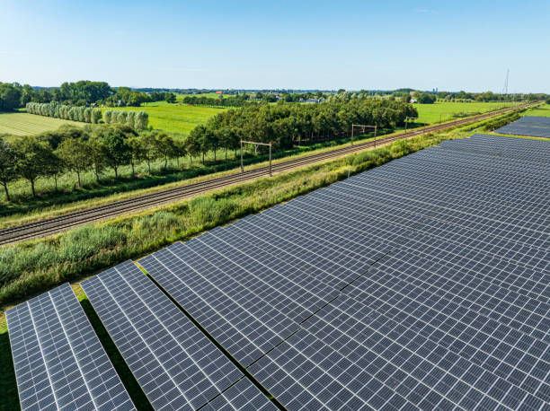 istock Solar farm and railroad track 2170011385