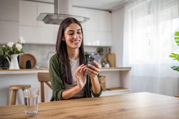 istock Modern communication, Woman on the phone at the table 2170013023