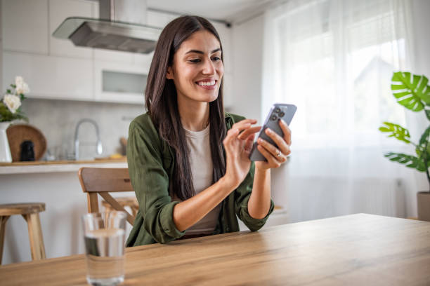 istock Modern communication, Woman on the phone at the table 2170013464
