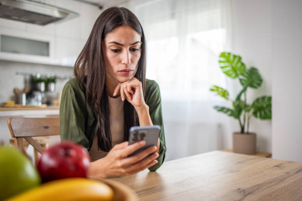 istock Modern communication, Woman on the phone at the table 2170013782