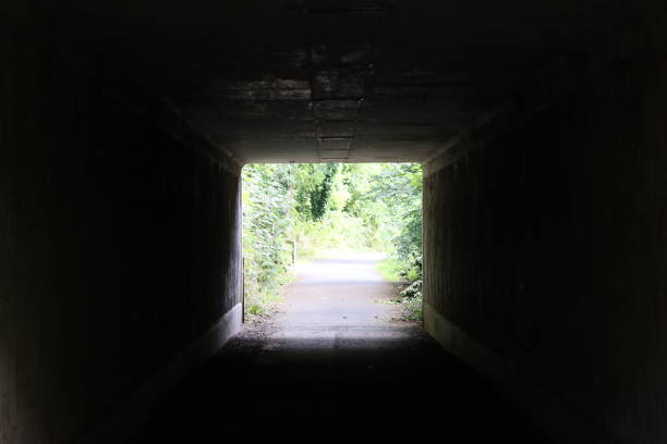 istock Light at the end of an underpass beneath a road 2170013820
