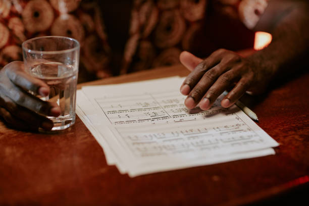 istock Unrecognizable Man With Sheet Music On Table 2170013822