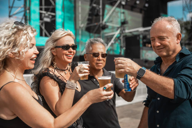 Four beautiful diverse senior friends enjoying downtime together at a daytime dance event