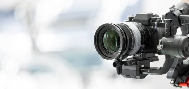 Gimbal video camera, Videographer using dslr camera anti shake tool for stabilizer record video.