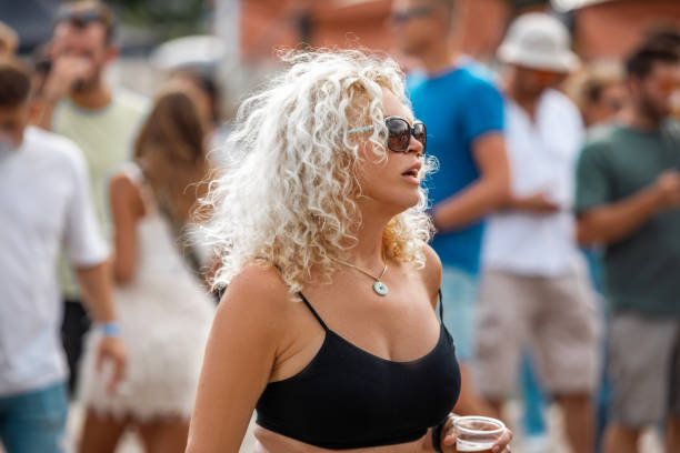 A beautiful senior woman enjoying downtime at a daytime dance event