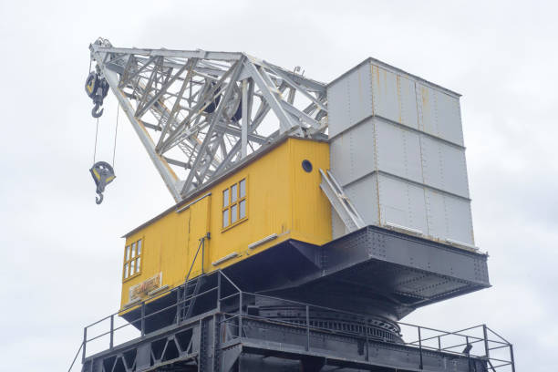 Vintage harbor crane in cloudy day