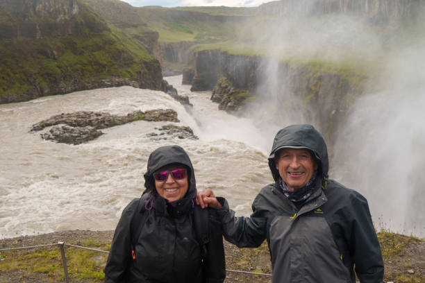 istock Couple enjoying Gullfoss waterfall in Iceland 2170017274