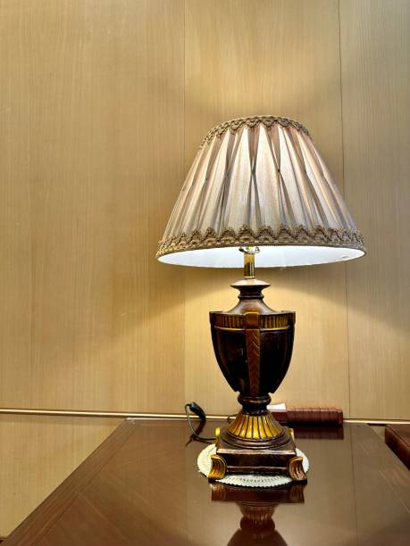 istock Old lamp on wooden table 2170019950