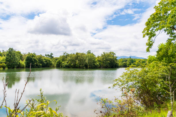 istock Serene Lake with Reflections of the Sky 2170022908