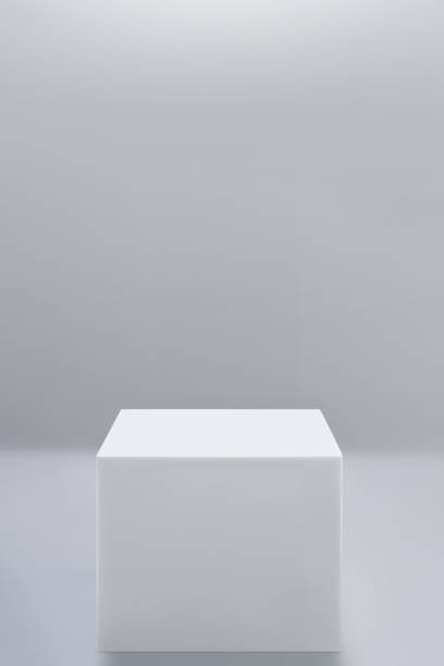 istock White square podium pedestal in white background. Clean empty wall scene. Minimal mockup or abstract product display presentation, Stage showcase. 2170022932