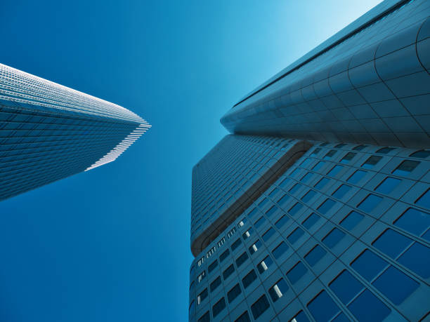 istock shot between the skyscraper towers racing through the sky with blue sky 2170026112