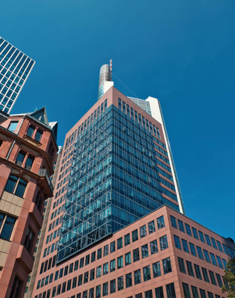 istock skyscraper, Frankfurt am Main with a red facade and a glass front in a clear sky 2170026201