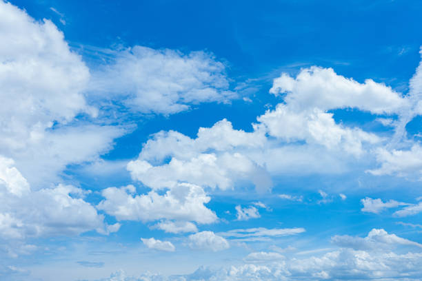 istock Bright blue sky with fluffy white clouds in a sunny day 2170028371