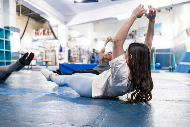 istock Young woman doing isometric exercise at the gym 2170029756