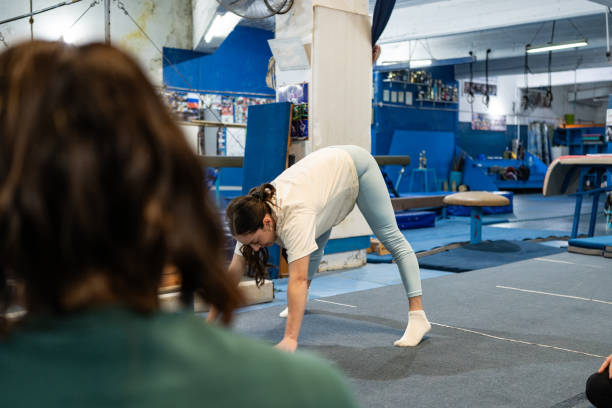 istock Young woman stretching at the gym 2170030012