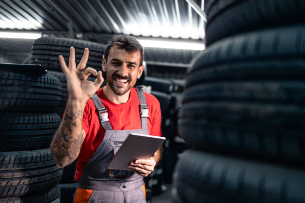 istock Employee organizing tire inventory in warehouse. 2170032967