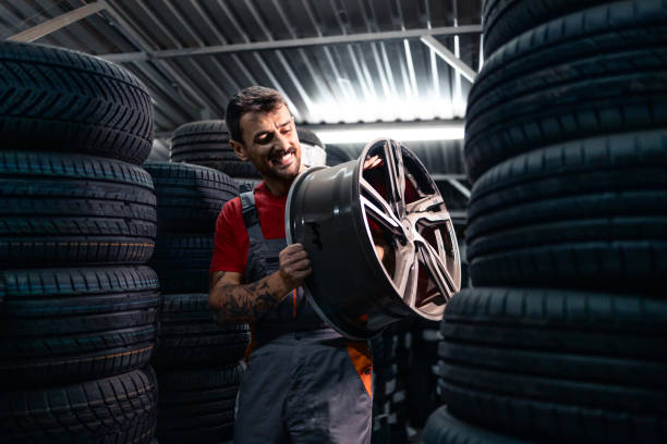 istock Working in automobile industry, distributing car tires and wheel rim. 2170033073