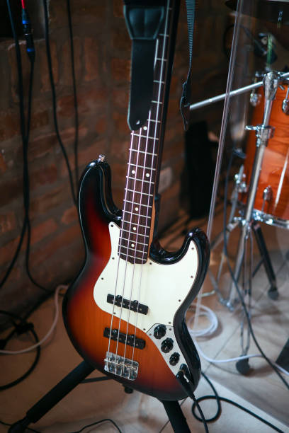 istock White and orange electric bass guitar 2170034478