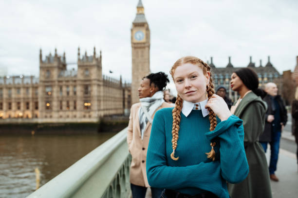 istock A group of three multi ethnic students smiling and embracing each other with the iconic Big Ben and Houses of Parliament in the background in London. 2170034497