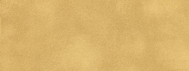 istock Yellow background suede fabric, closeup. Velvet texture seamless golden textile, macro. Structure ocher felt 2170037329