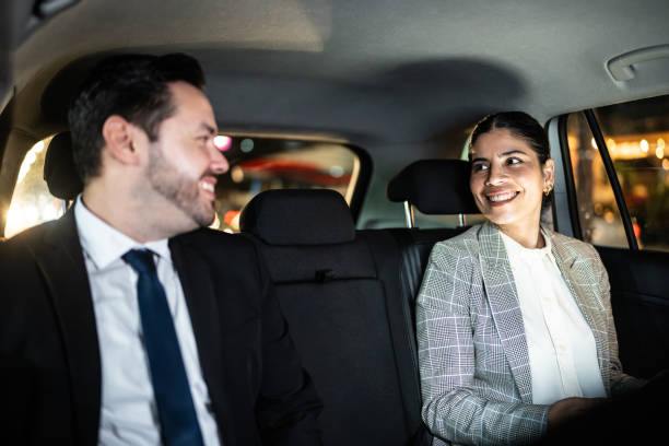 istock Coworkers talking inside a taxi 2170037899