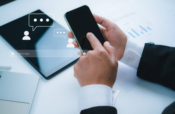 istock Human hand using smartphone typing, Chatting conversation in chat box icons pop up, Social media marketing concept, Chatting on application communication digital web and social network concept. 2170040805