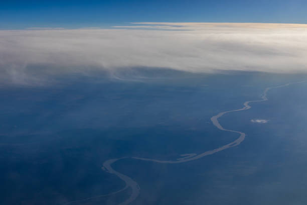 Aerial view to landscape with river and cumulus cloud