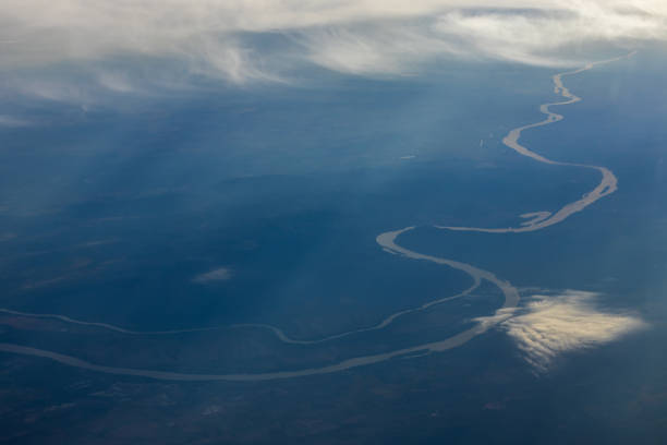 Aerial view to landscape with river and cumulus cloud