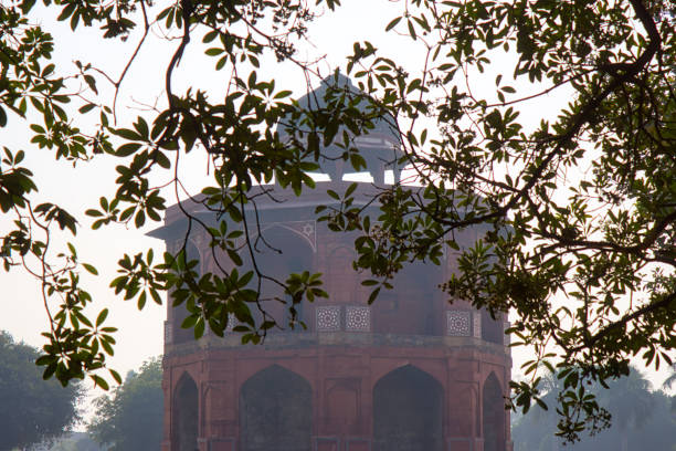 The Purana Quila, or Old Fort, stands as a testament to Delhi's rich and tumultuous history. Nestled within its fortified walls lies a treasure trove of architectural marvels, each telling a unique tale of the city's past. Among these architectural gems is a magnificent gateway, its intricate details and towering structure captivating the imagination of visitors from around the world.This gateway, though often overshadowed by the more famous Red Fort, is a masterpiece of Mughal architecture. Its design is a harmonious blend of Persian and Indian styles, reflecting the cosmopolitan nature of the Mughal empire. The towering dome, a symbol of Mughal power and authority, rises majestically above the surrounding structures. Its intricate carvings, adorned with floral motifs and geometric patterns, showcase the exquisite craftsmanship of the artisans who created it.The gateway's exterior is a testament to the passage of time. The weathered stone, marked by the elements, tells a story of centuries of resilience and endurance. The cracks and fissures that have developed over the years add to its character, lending it a sense of authenticity and history. Yet, despite the ravages of time, the gateway's beauty remains undiminished.