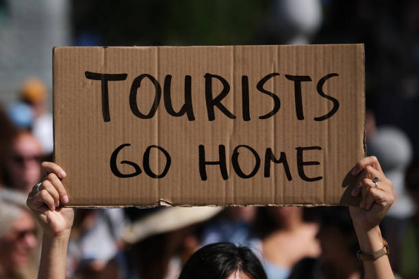 istock Protest Sign Tourists Go Home 2170048666