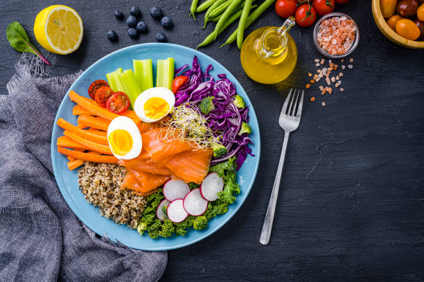 istock Healthy and fresh salmon, quinoa and vegetables salad. 2170051919