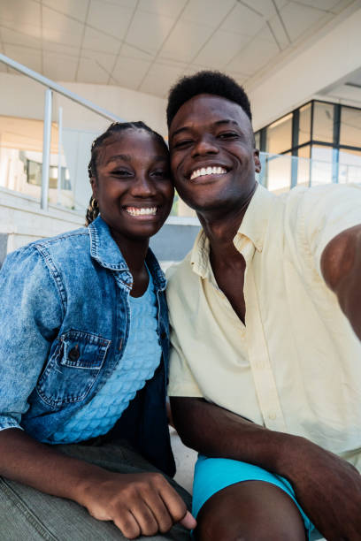 istock Young couple taking a selfie outdoors - Camera point of view 2170052461