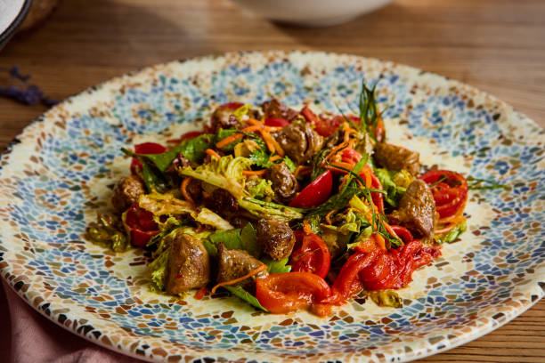 istock Fresh Chicken Heart Salad with Colorful Vegetables on Decorative Plate 2170052538