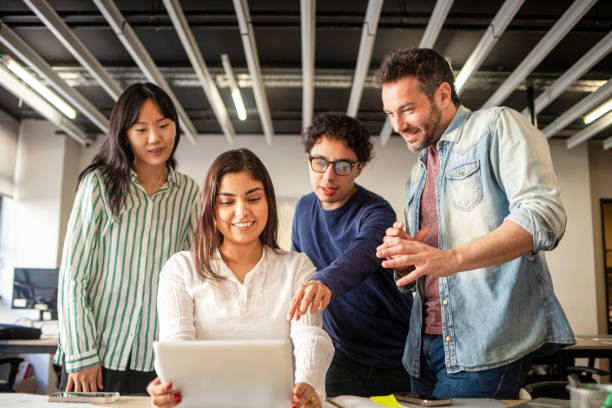 istock Young diverse group of professionals developing new company project in brainstorming session 2170053619