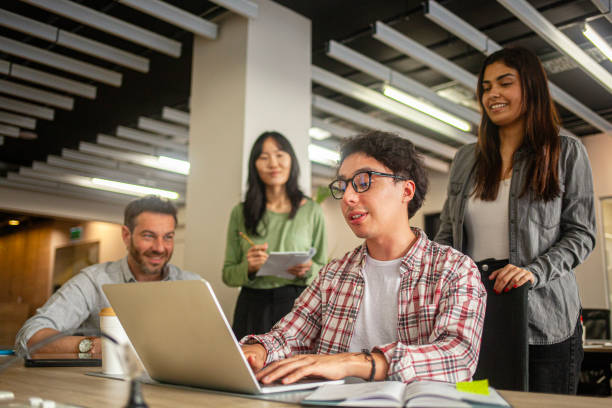 istock Diverse group of young professionals collaborating on company assignment 2170053752