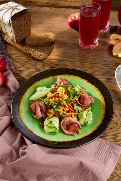 istock Fresh Roast Beef Salad with Vegetables on a Green Plate 2170053837