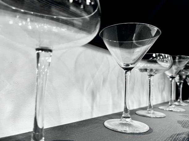 istock A row of empty wine and cocktail glasses on a dusty shelf 2170053900