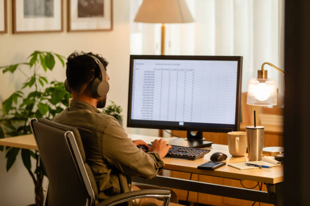 istock Unrecognizable male financial advisor works on spreadsheets at home 2170054059