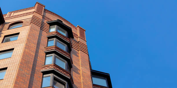 istock modern building loft design facade down town architecture city scape view point from below panoramic perspective blue sky background empty copy space 2170056288