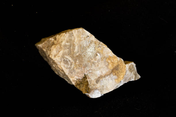 istock A piece of plagioclase feldspar (NaAlSi3O8) on a black background 2170056638